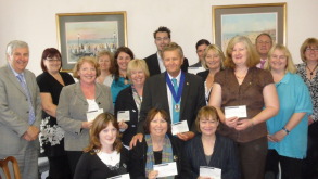 Manx Telecom Bay Festival cheque presentation held at Nadine House on 19th July 2010.  Representatives from the ten nominated charities: A Call to Business, Connect2Charity, Crossroads Caring for Carers, Hospice Care, Kemmyrk, Mannannan Lions Club, Manx Foundation for the physically disabled, Southern Befrienders, The Children's Centre and representatives from Manx Telecom.  The Isle of Man Bay Festival was held over the weekend of 18,19 and 20th June 2010 at Nobles Park. 